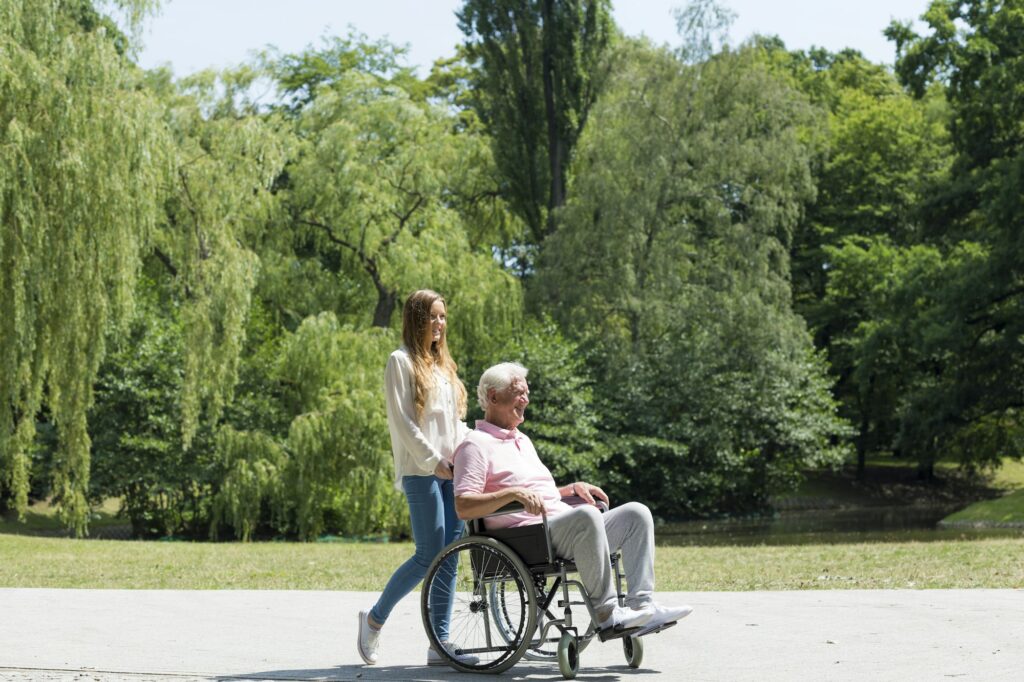 Young girl with elder man in the park
